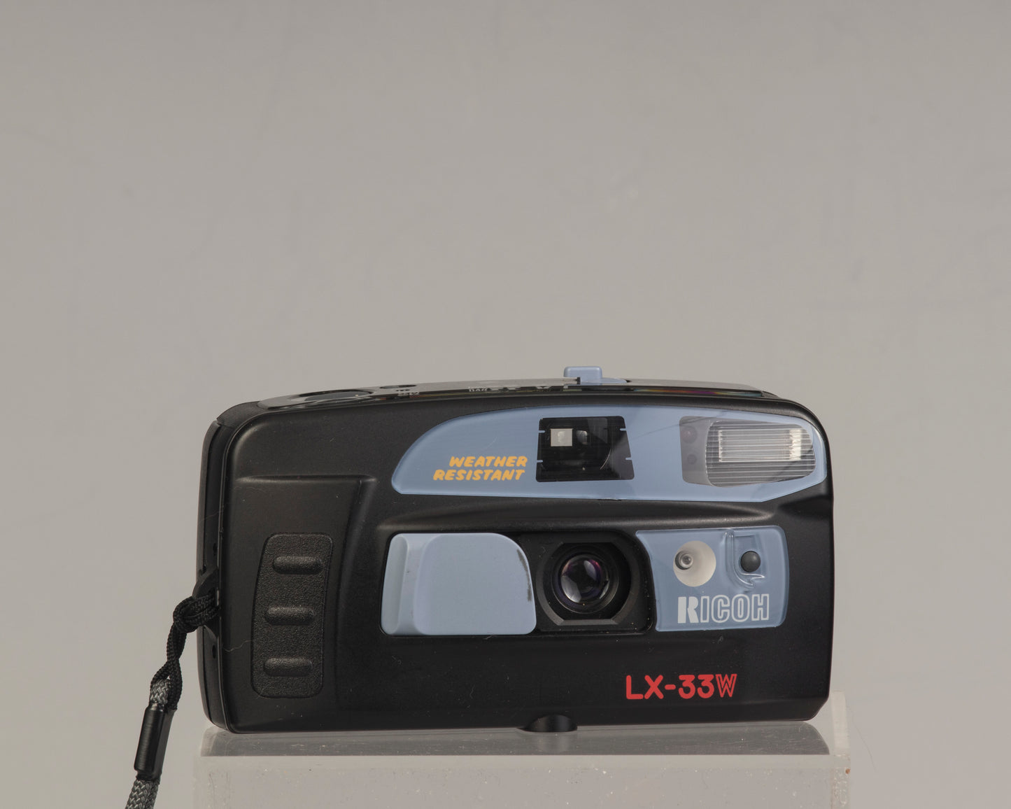 The Ricoh LX-33W is a simple weather-resistant 35mm film point-and-shoot camera from the 1990s