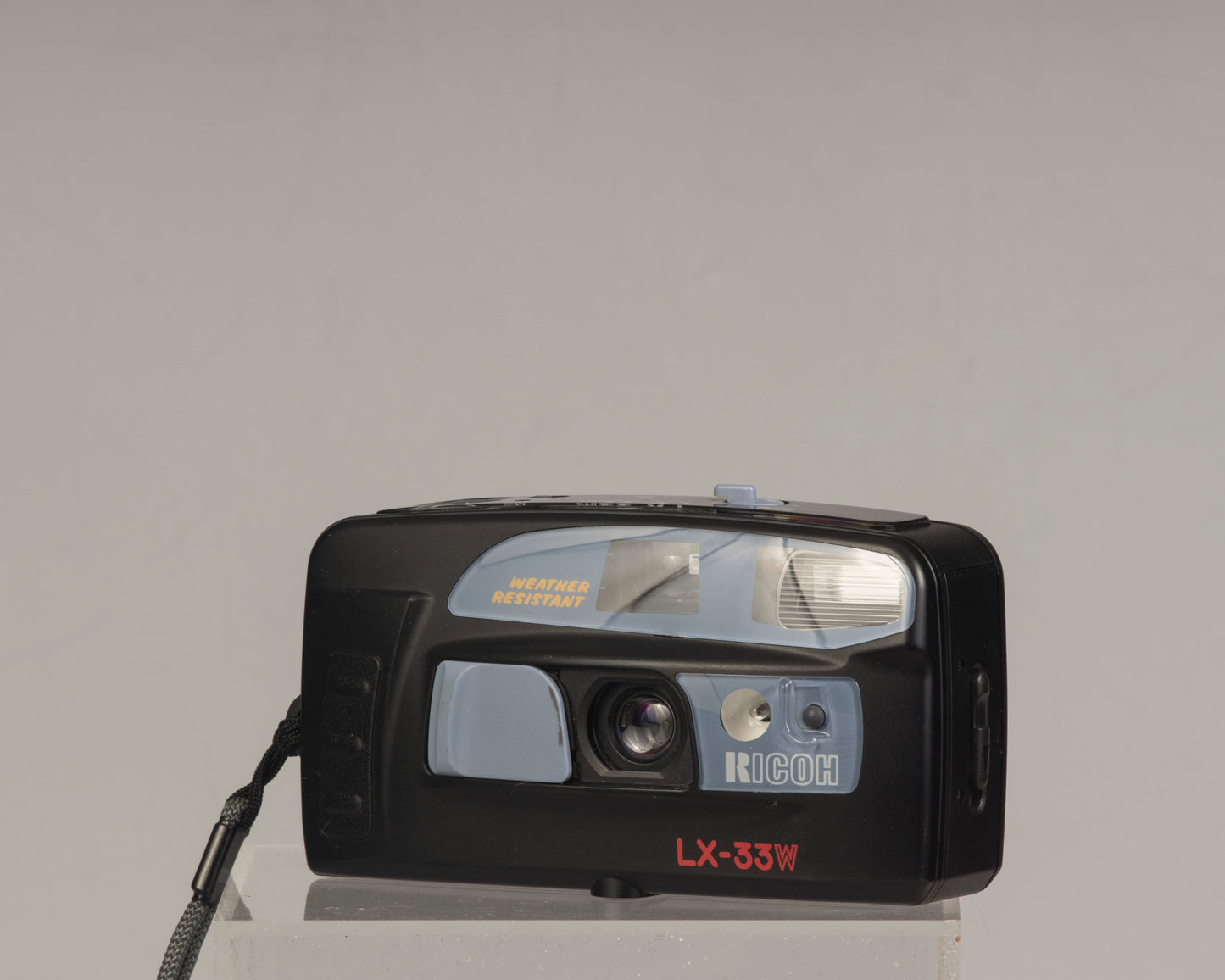 The Ricoh LX-33W is a simple weather-resistant 35mm film point-and-shoot camera from the 1990s