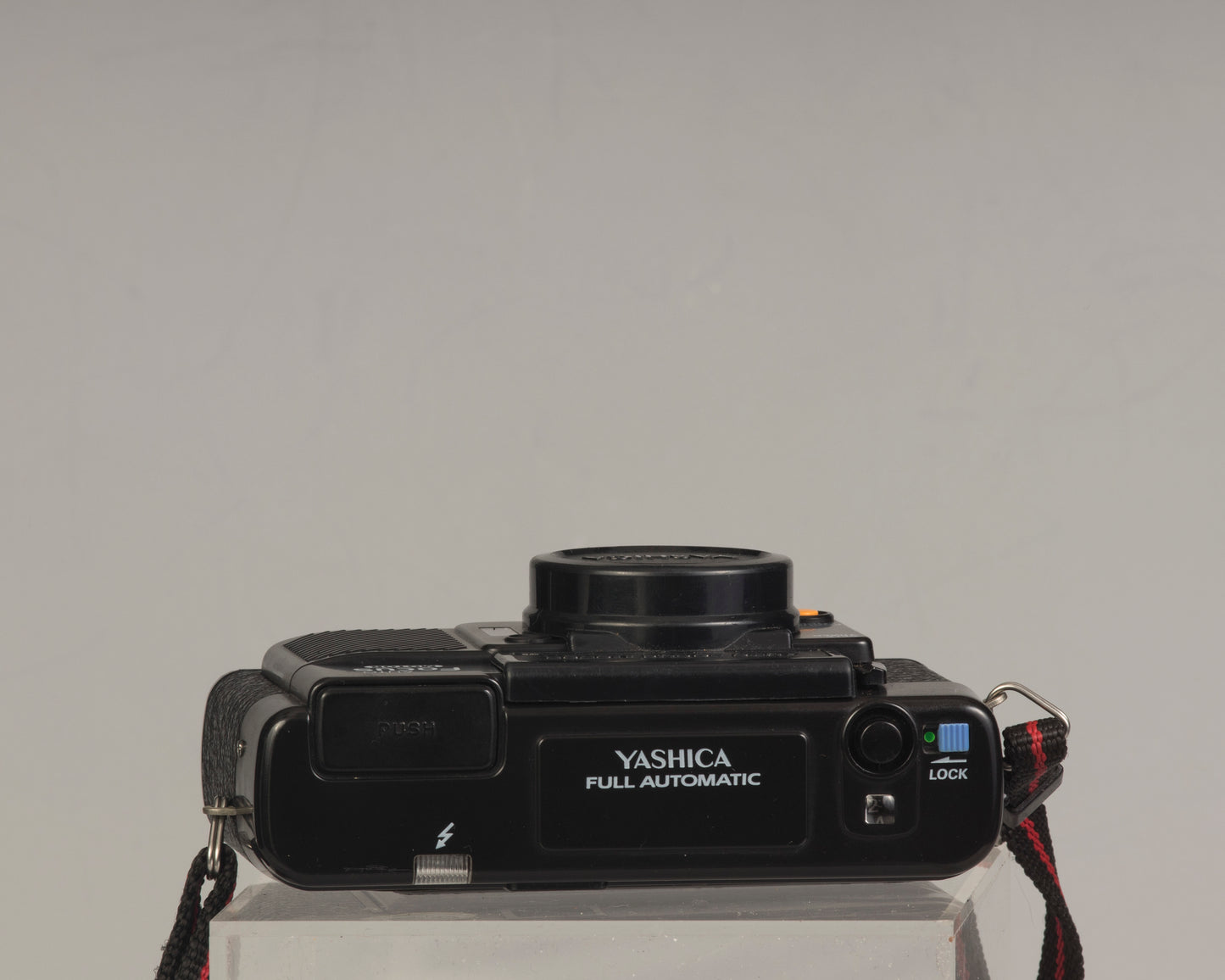 The Yashica Auto Focus Motor (top view shown) is a classic 35mm point-and-shoot film camera featuring a 38mm f2.8 lens