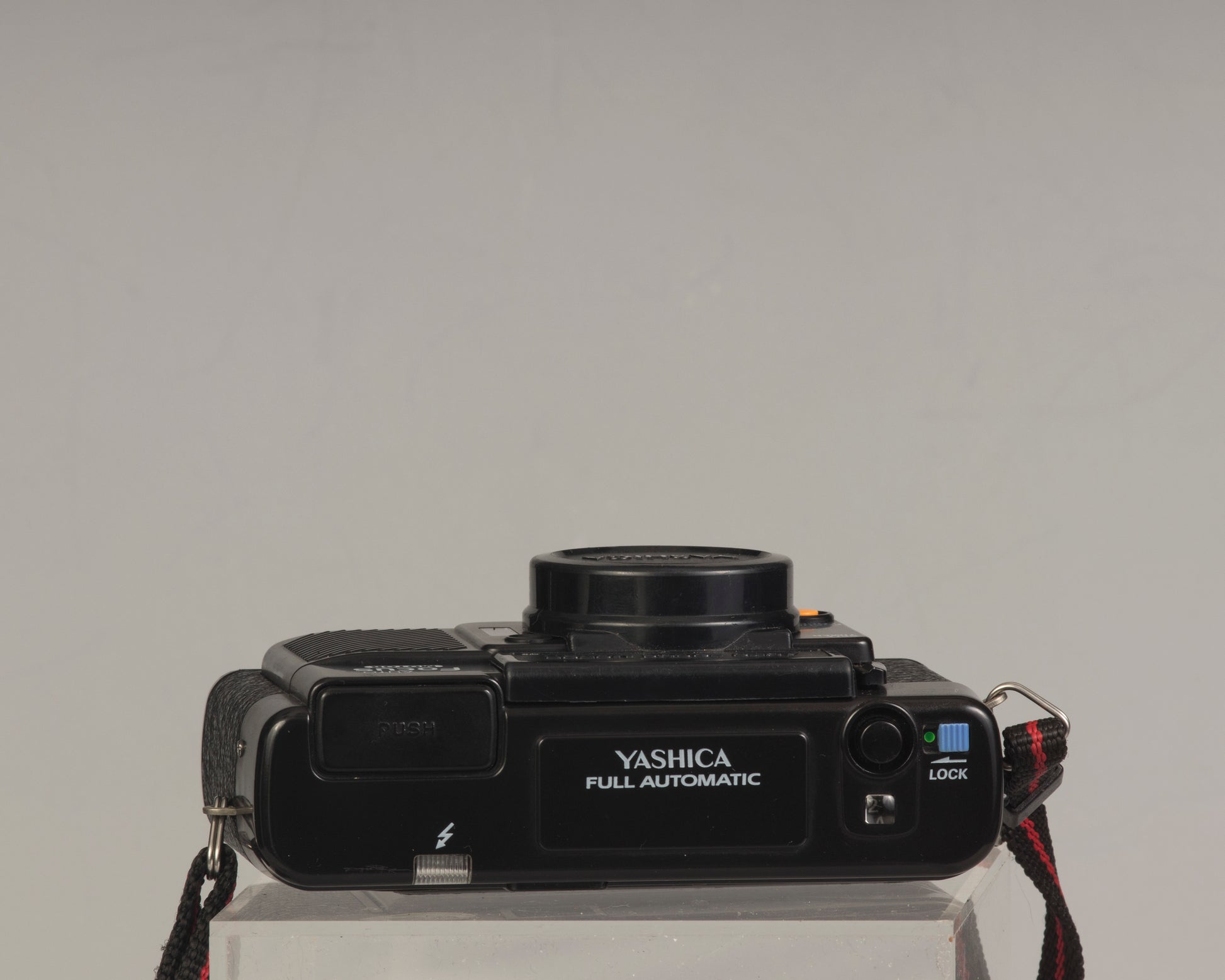 The Yashica Auto Focus Motor (top view shown) is a classic 35mm point-and-shoot film camera featuring a 38mm f2.8 lens
