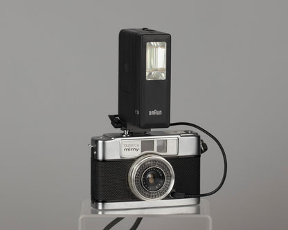 Yashica Mimy half-frame 35mm camera plus Braun flash