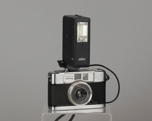 Yashica Mimy half-frame 35mm camera plus Braun flash
