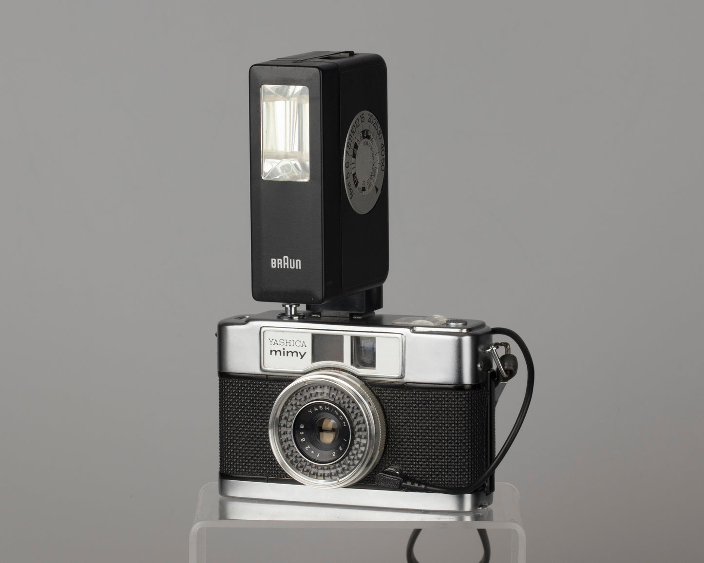 Yashica Mimy half-frame 35mm camera plus Braun flash