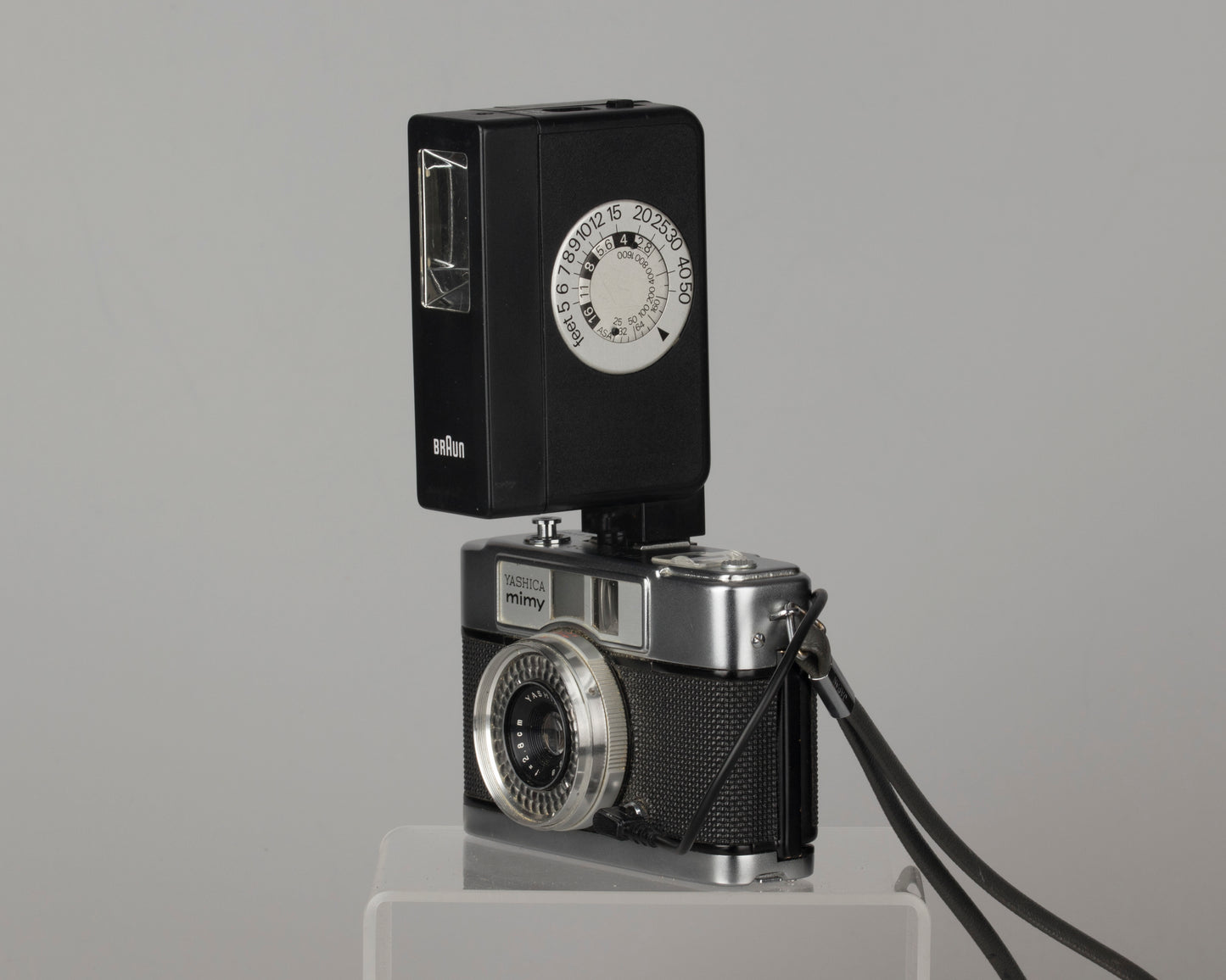Yashica Mimy half-frame 35mm camera plus Braun flash