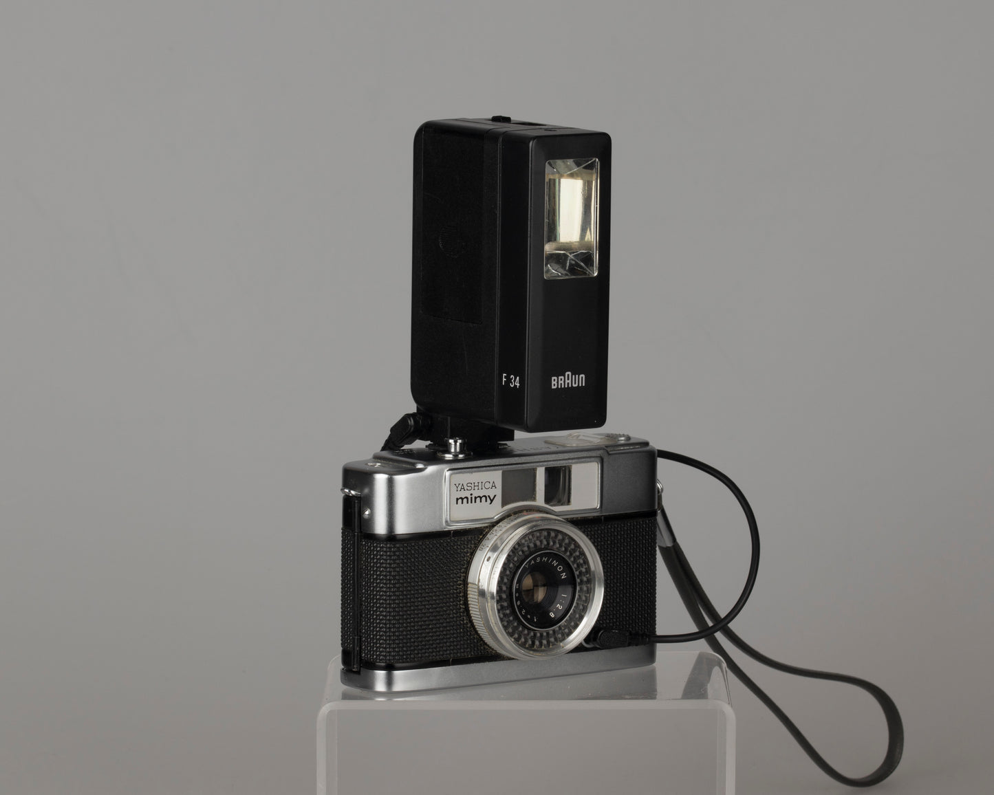 Yashica Mimy half-frame 35mm camera plus Braun flash