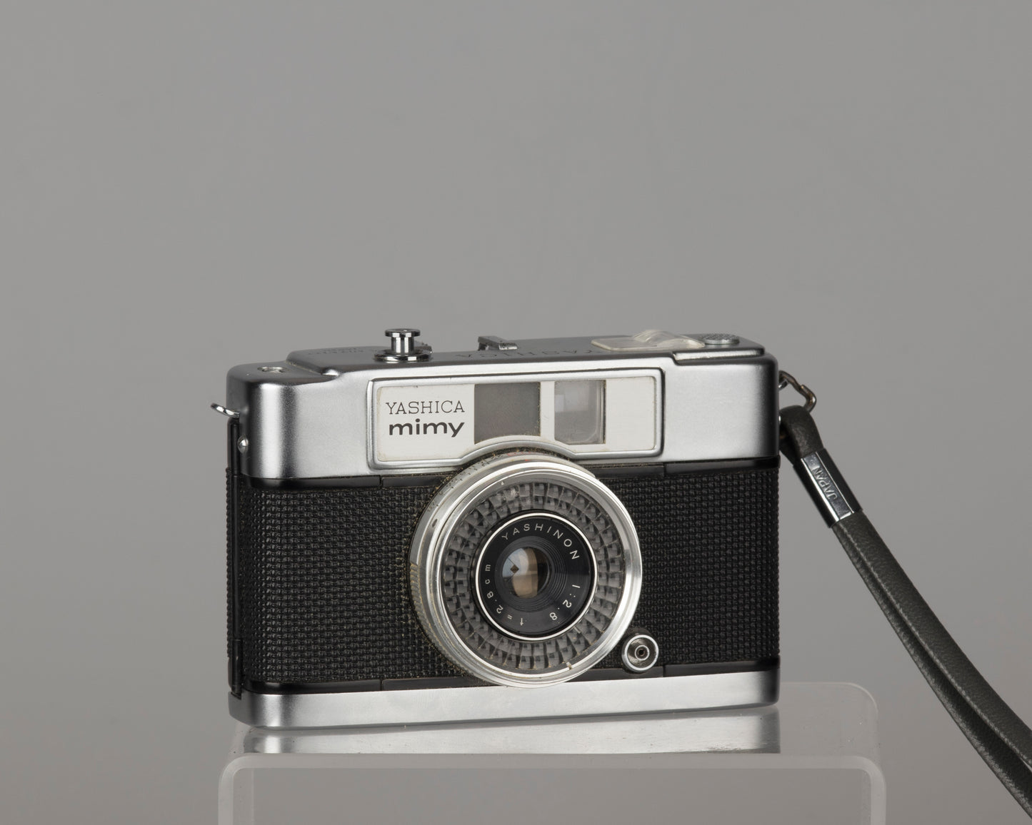 Yashica Mimy half-frame 35mm camera plus Braun flash