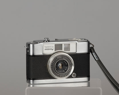 Yashica Mimy half-frame 35mm camera plus Braun flash