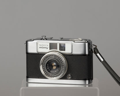 Yashica Mimy half-frame 35mm camera plus Braun flash