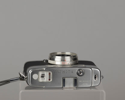 Yashica Mimy half-frame 35mm camera plus Braun flash