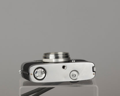 Yashica Mimy half-frame 35mm camera plus Braun flash